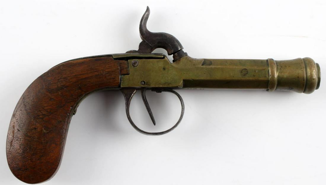 19TH CENTURY MINIATURE PERCUSSION BOOT PISTOL: 19th century miniature percussion boot pistol. Brass construction on the barrel. Wooden handle. Stamped "FM 17", "1", and "1847" on the barrel of the pistol. Measures approximately 6 inches long. In w