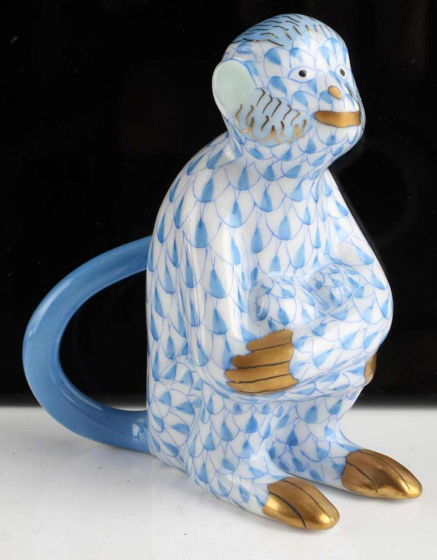 HEREND PORCELAIN BLUE SITTING MONKEY FIGURE: Herend Hungary porcelain, hand painted, blue fishnet "Sitting Monkey" figure. In very good condition with no cracks, loss or repairs noted. Dimensions: 2 1/2 x 3 x 1 1/2 inches