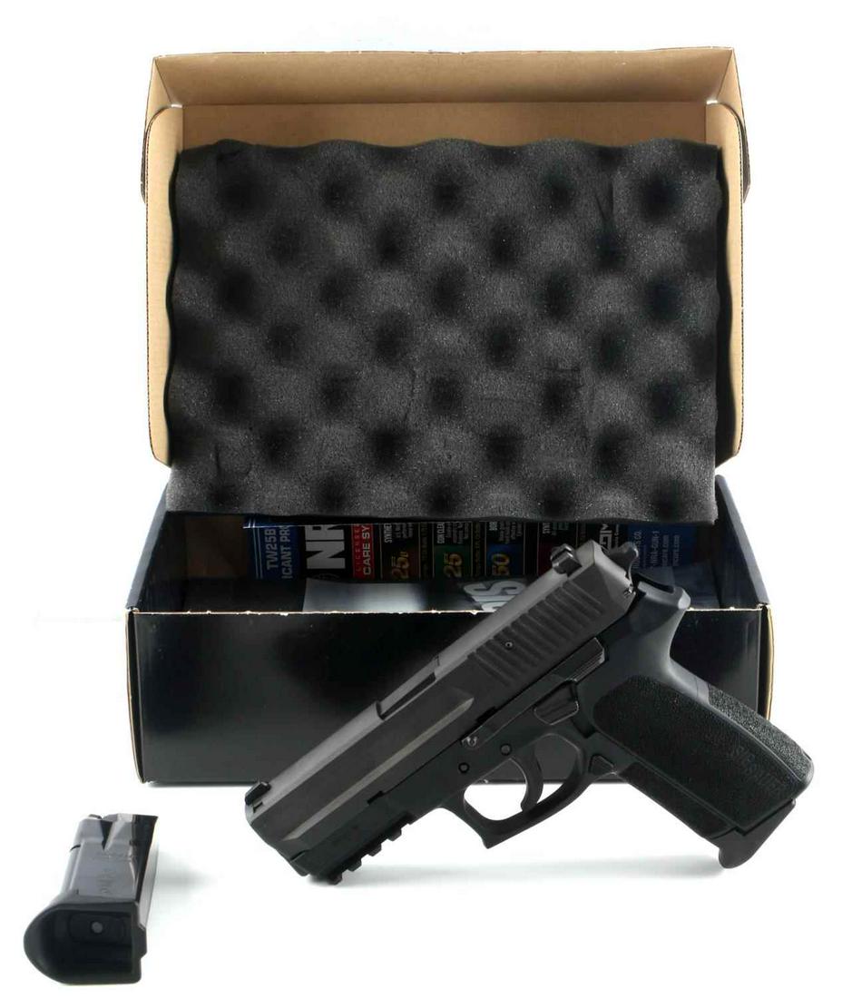 SIG SAUER SP2022 .40 CAL S&W PISTOL & 2 MAGAZINES: Double and single action. Stainless-steel slide with a black Nitron® finish. Black polymer frame with an integral accessory rail. Interchangeable textured grip assemblies. Modular fire control unit. 