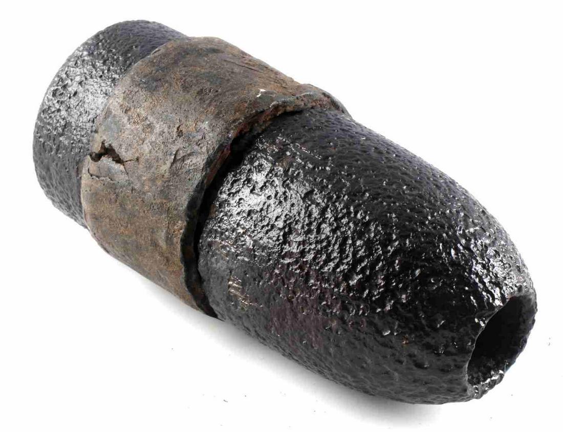 CIVIL WAR ERA HOTCHKISS ARTILLERY SHELL W SABOT: Civil war era Hotchkiss artillery shell with sabot still attached, meaning the round was likely never fired. Likely an American shell, not a confederate one. In relatively good condition.
