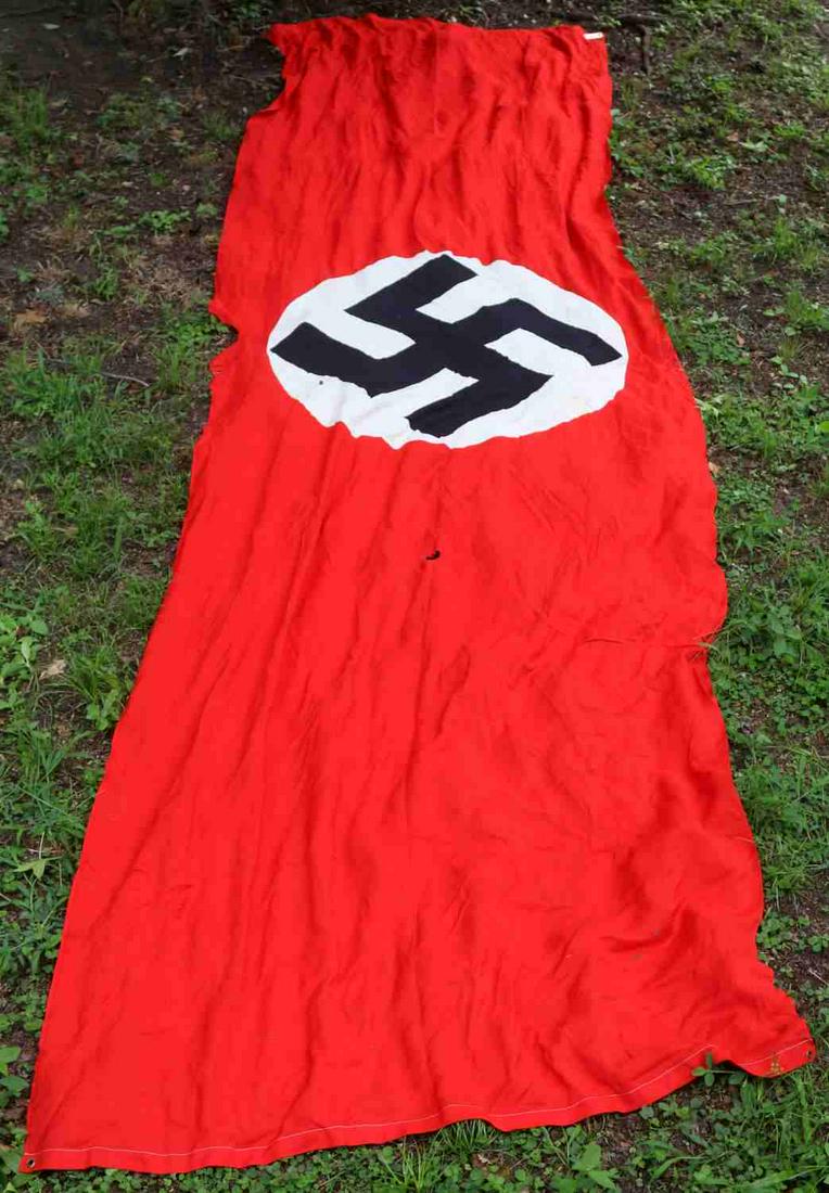 WWII GERMAN REICH VERY LARGE NSDAP PARTY BANNER: WWII German Reich large NSDAP banner measuring approximately 185 inches inches tall by 40 inches wide. In good condition considering its old age. Does not fluoresce. An inch sized hole just below the