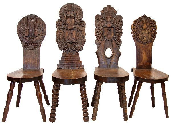 CARVED OAK HERMANN GOERING FAMILY CHAIRS: A unique group of four solid oak, hand carved chairs. Two have Hermann Goerings family crest and swastika emblem, one with his second wife's (Emmy Sonnemann's) coat of arms. The fourth chair has and o