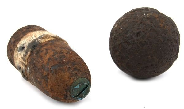 CIVIL WAR HOTCHKISS SHELL & 10 LB. CANNON BALL: A fuse plug Hotchkiss 2.94 shell weighing 9 pounds and measuring 6.7/8 inches, excavated condition with plug intact, also a 10 lb cannon ball in same or similar condition.