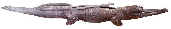 LARGE NEW GUINEA CROCODILE SLIT DRUM: Approximately 95 inch long intricately carved wood crocodile slit drum, or garamut, from the Septik region of New Guinea. The garamut is made from a single log hollowed through carving and burning. Th