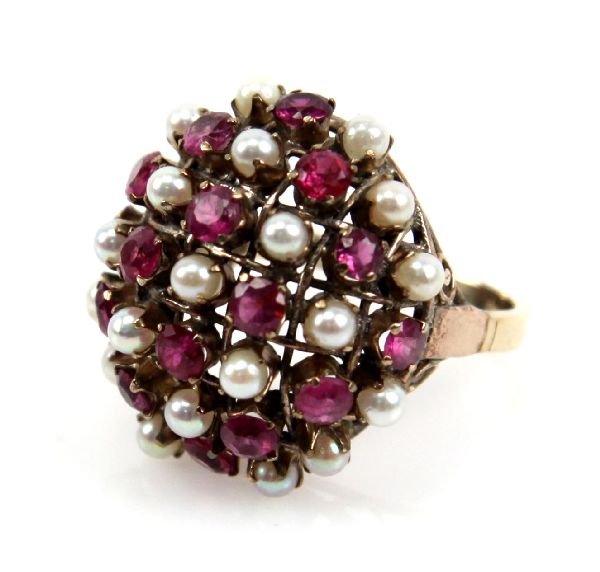 LADIES 14K PEARL & RUBY RING: Dome style ring with 16 rubies and 21 pearls. Each ruby is approximately 1/8 ct for 2 Tcw in rubies. . Size: 6.25 . Weight: 6.5g . Condition: Very Good