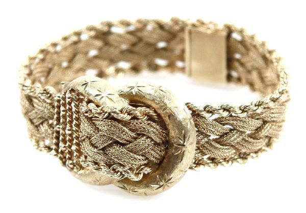 LADIES 14K GOLD LUCIEN PICCARD WATCH: Ladies size 7 Lucien Piccard 14K gold wristwatch. In the design on a belt. 17 jewel movement.