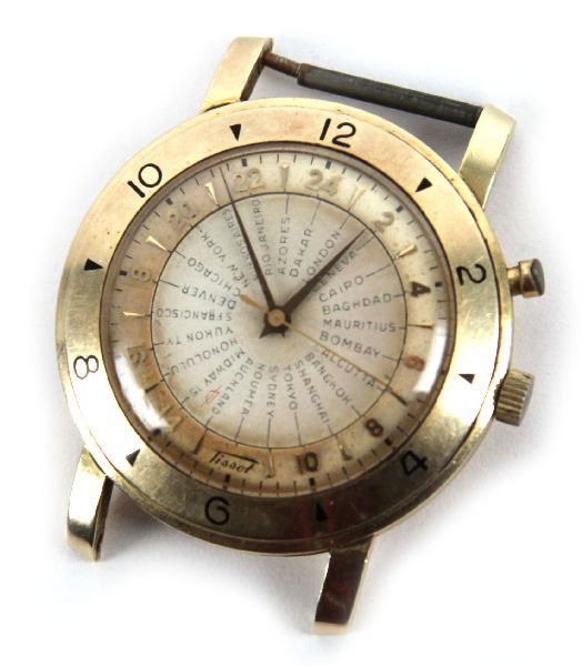 VINTAGE TISSOT MENS 14K GOLD NAVIGATOR WATCH: A men's 14K Gold watch with 24 hour dial and listing 25 different cities. Including places like Midway Islands, Shanghai, Yukon Territory and Dakar. Weighs 36.23g. In original box. No band. Not runnin