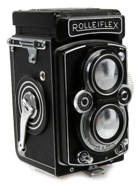 ROLLEIFLEX ZEISS TESSAR 3.5 CAMERA W/ LEATHER CASE: A vintage German-made Rolleiflex camera with Zeiss Tessar 3.5 twin lens and automatic film transport mechanism. Camera is in excellent condition and includes the original leather case, box, and owners