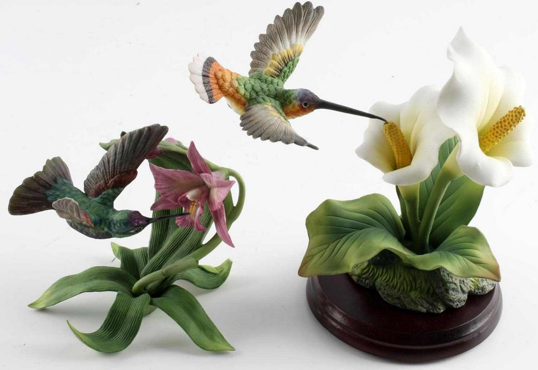 LENOX & PORCELAIN HUMMINGBIRD FIGURINES: Marked Magnificent Hummingbird, fine porcelain, Lenox 1992. This piece measures 5 x 4 1/2 inches. Second is unmarked porcelain decorative figurine with hummingbird set as if in flight. This delicate p
