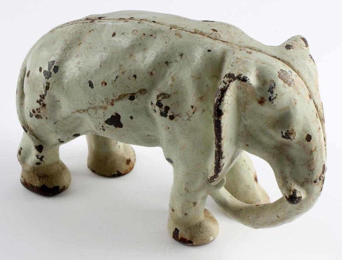 ANTIQUE HUBLEY CAST IRON ELEPHANT DOORSTOP: Dimensions: height 4 7/8 inch, 7 1/8 inch 2 1/2 inch. Nice seem line, standard screw, scatted paint loss.