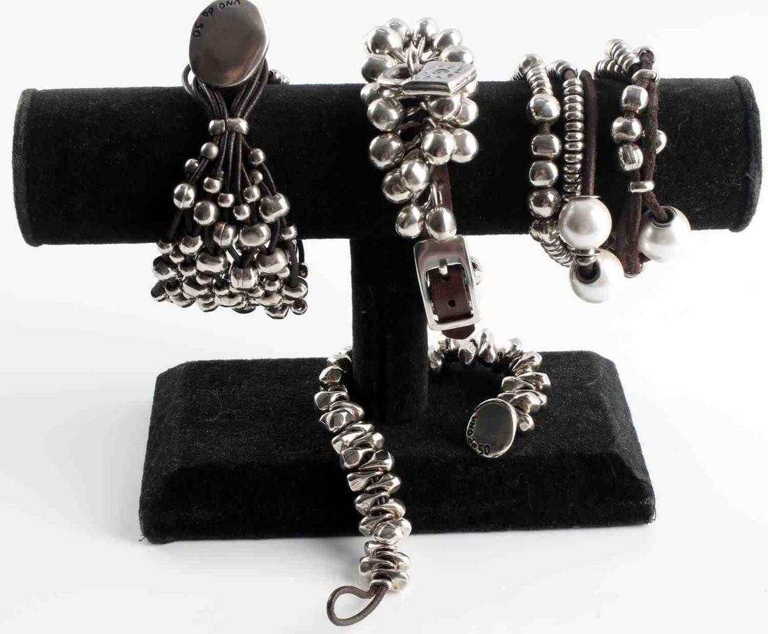 UNO DE 50 DESIGNER SILVER AND LEATHER BRACELETS: Lot of 4 Uno de 50 contemporary designer pieces are created with sterling silver plated beads on leather. Each measure 7 inches and are in very good wear or resale condition.