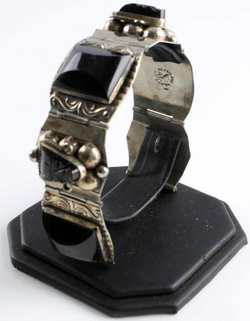 STERLING SILVER & ONYX MAYAN AZTEC PANEL BRACELET: Stamped Hecho Mexico sterling 925, vintage Mayan Aztec panel bracelet. Length 6 3/4 inches. In good condition. Total weight 64.4 grams This lot has a reserve.