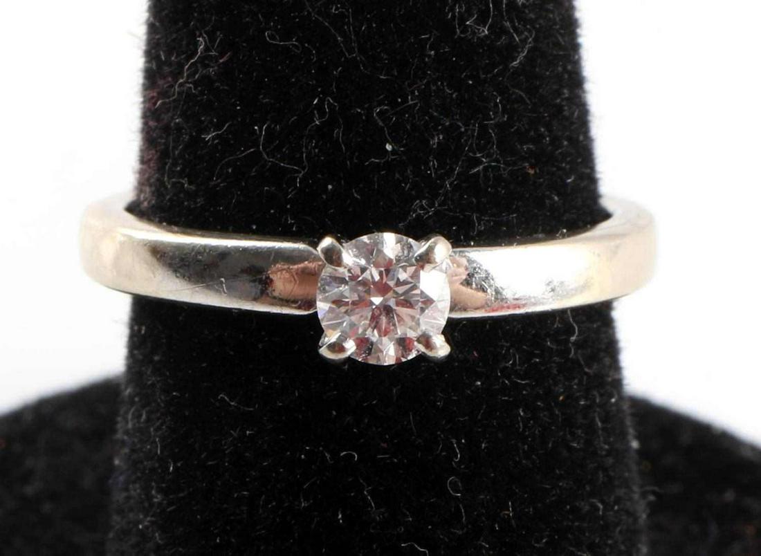 14 KT GOLD DIAMOND SOLITAIRE ENGAGEMENT RING: Marked and tested as 14 kt white gold with 4mm round brilliant solitaire diamond, .20 carat, est. VS, F-H. Total weight 2.4 grams. Size 5 1/2 This lot has a reserve.