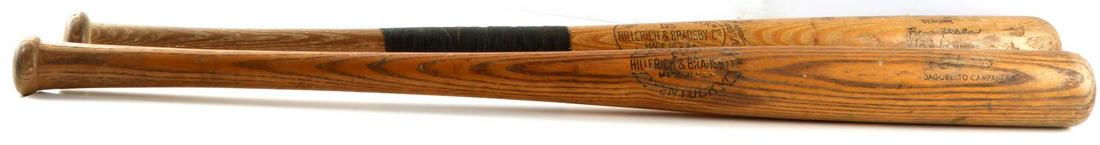 VINTAGE 2 LOUISVILLE SLUGGER H&B 125 CA6 USED BATS: One (1) Hillerich & Bradsby Co. Louisville Slugger 125 powerized Harman Killebrew baseball bat. Tape grip to the center of the bat. Game used condition. One (1) H&B Louisville Slugger CA6 Safe Hit pow