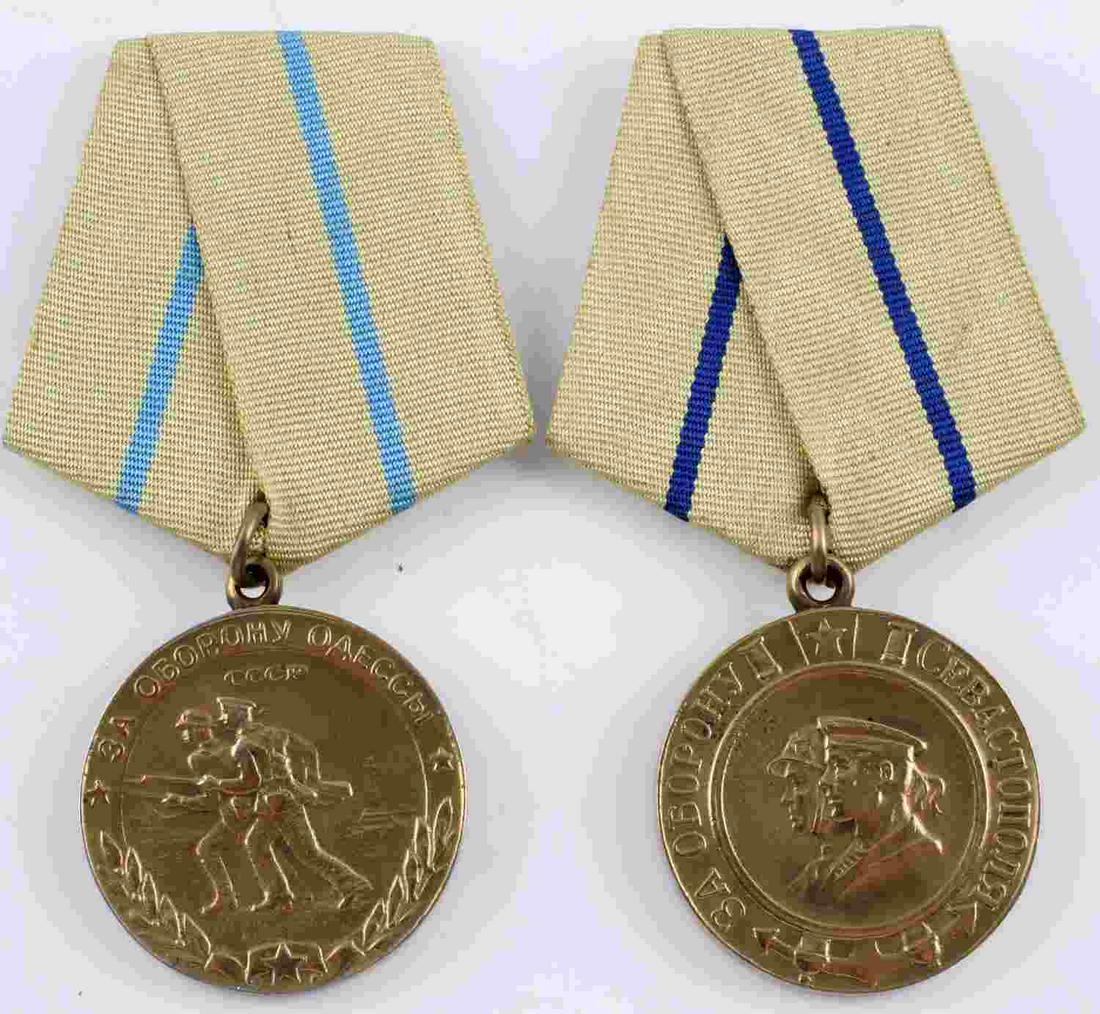 2 WWII SOVIET RUSSIAN DEFENSE OF ODESSA SEVASTOPOL: Two (2) WWII Soviet Russian medals for the Defense of Odessa and the Defense of Sevastopol. Defense of Odessa medal features two soldier on the obverse with a yellow with teal stripe ribbon. Defense o