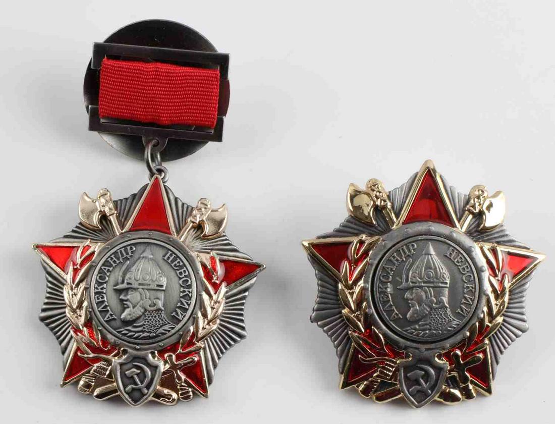 SOVIET ORDERS OF ALEXANDER NEVSKI MEDALS: Nickel construction with gold tone and red enamel. One has ribbon above, the other has a screw-on back. Numbered to reverse. Good condition. Unauthenticated, sold as is.