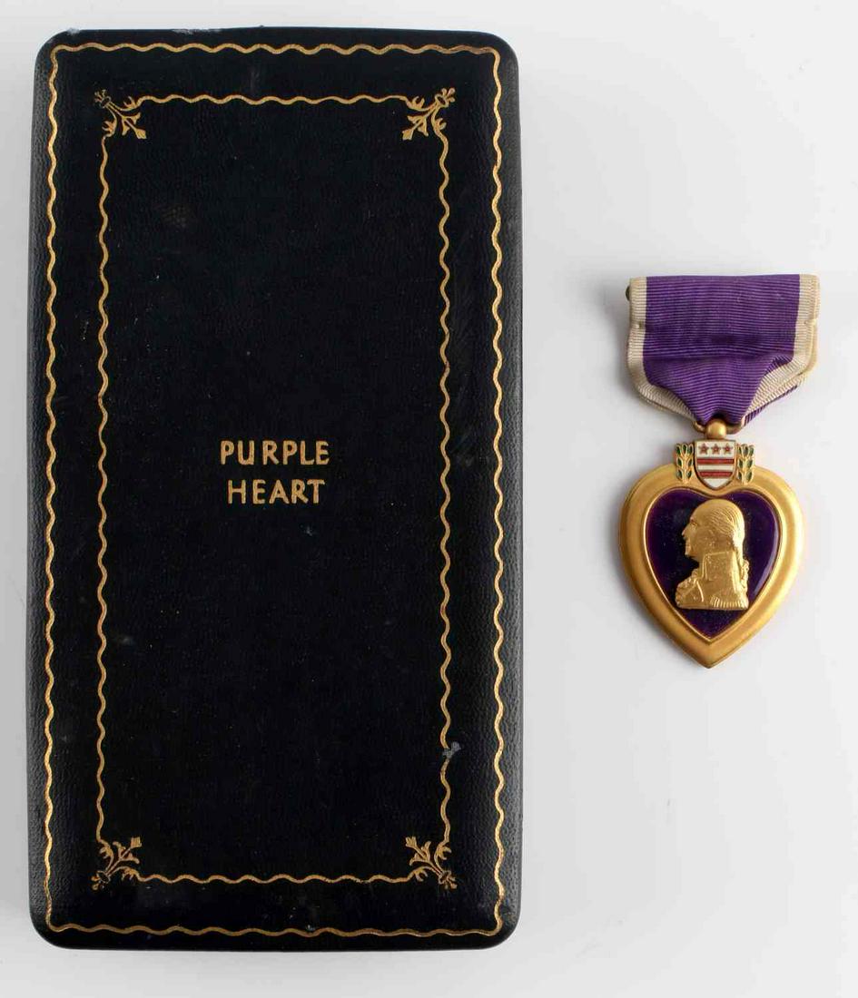 WWII U.S. NAVY PURPLE HEART MEDAL AWARD NAMED: WWII U.S. Navy Purple Heart medal award cased and named. Named to Roy N. Harrison. In original case. Measures 1.5 inches in diameter and 3.5 inches long with the ribbon, the case measures 3.5 X 7 inch