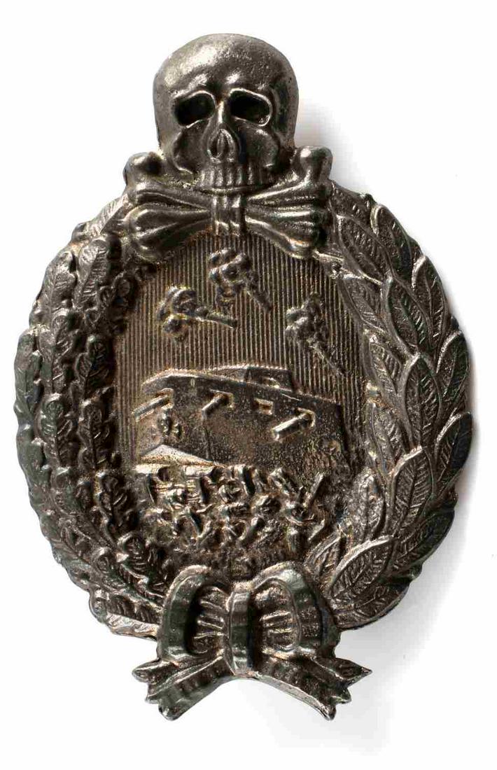 WWI IMPERIAL GERMAN PANZER TANK ASSAULT BADGE: WWI Imperial German Panzer Tank assault badge. Measures approximately 2 X 3 inches. Unmarked on the reverse but features a vertical 'c' catch hook back with a 180 degree pin lie. Very good condition o