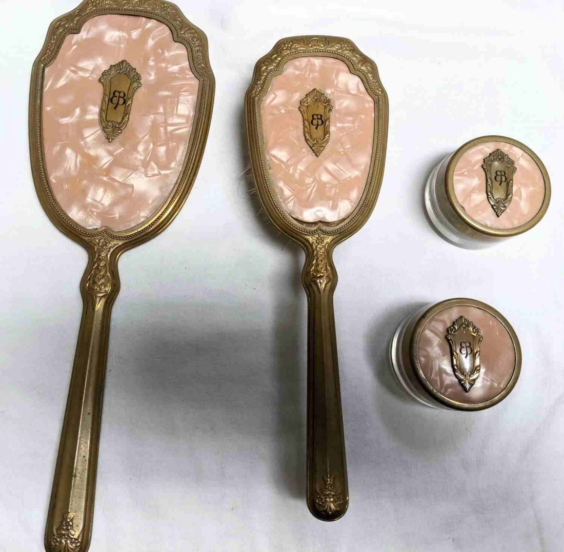 SET OF 4 EVA BRAUN MONOGRAMMED VANITY ITEMS: Lot includes: brush, mirror, and two powder/cream containers with lids. Metal with pink synthetic material. All pieces have initials etched to ornate brass label. Pink pieces are somewhat loose. Good 