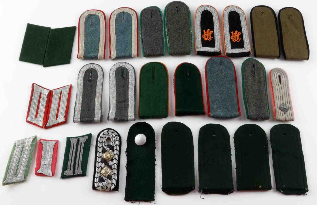 28 WWII GERMAN THIRD REICH SHOULDER BOARDS TABS: Variety of 28 Third Reich shoulder boards and collar tabs from infantry, artillery, and engineers. Some fluoresce but most do not. Good condition. Measures 3 1/2 - 5 inches.