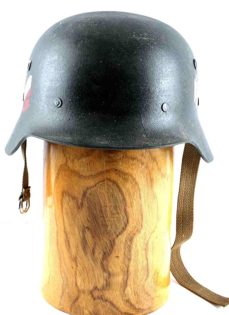 WWII GERMAN ARMY DOUBLE DECAL PARADE HELMET: Hard plastic helmet with Reichsadler decal at left ear, and shield decal at right ear. Canvas chinstrap and leather border liner. Front to back inside measurement is 8 inches. Good condition. Unauthen