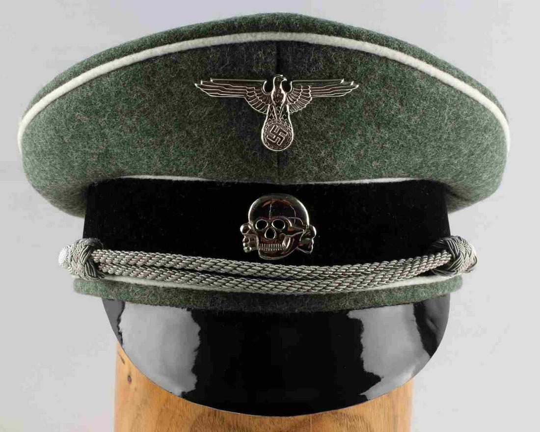 WWII THIRD REICH GERMAN WAFFEN SS OFFICERS HAT CAP: Green wool cap with eagle and totenkopf insignia at front center, grey piping, silver bullion chinstrap. SS and 57 marked to label inside. Very good condition. Unauthenticated, sold as is. This lot ha