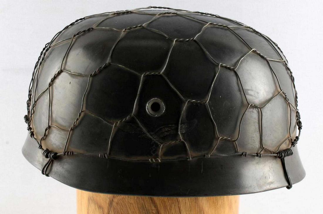WWII GERMAN THIRD REICH PARATROOPER HELMET SHELL: WWII German Luftwaffe Paratrooper helmet shell with wire and single decal. Stamped "5089" and "ET68" on the inside of the helmet. There is no liner or chinstrap with this helmet. Luftwaffe eagle prese