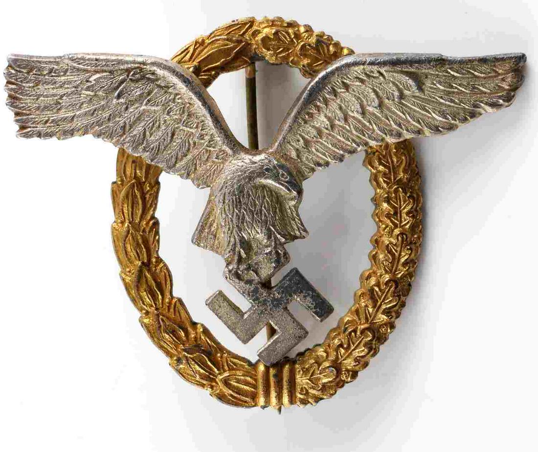 WWII GERMAN THIRD REICH LUFTWAFFE PILOT BADGE: WWII German Luftwaffe Pilot badge. Unmarked on the reverse and features a vertical pinback that has a 180 degree pin lie. Measures approximately 2.5 X 3 inches. Very good condition overall with the ex