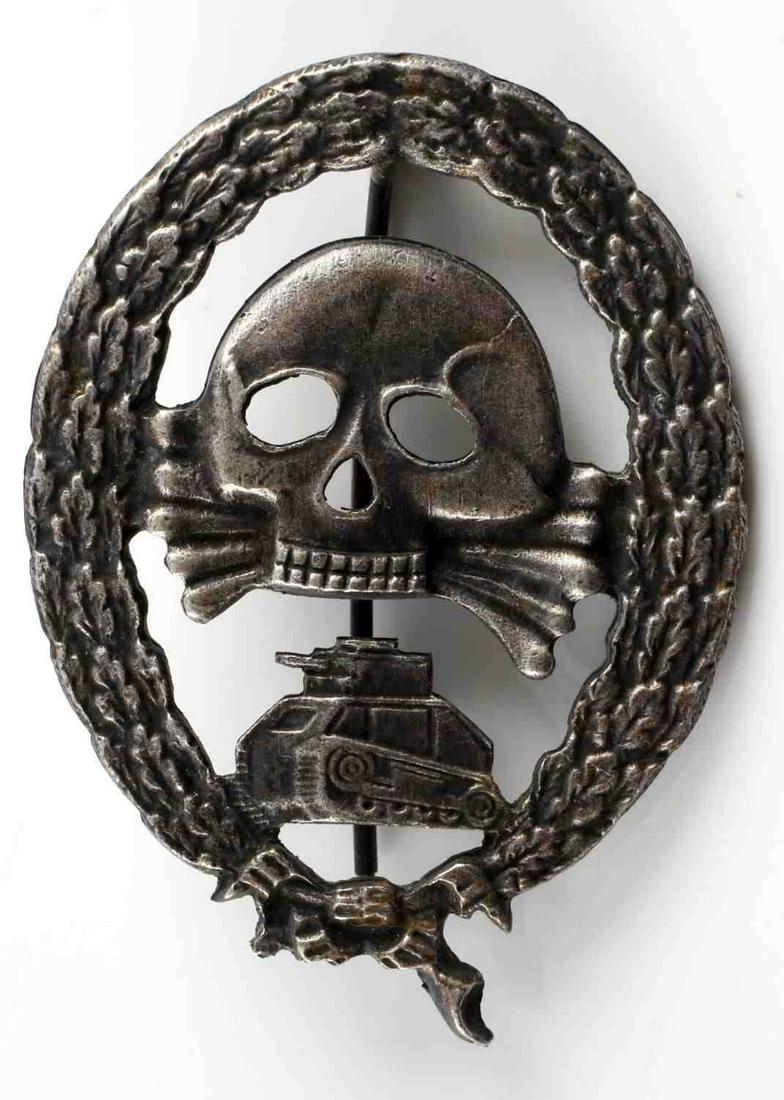 WWII GERMAN SPANISH CONDOR LEGION TANK BADGE: WWII German Spanish Condor Legion Tank Assault badge. Measures approximately 2 inches in diameter with a 180 degree pin lie. Unmarked on the reverse. Very good condition overall. Unauthenticated; sold
