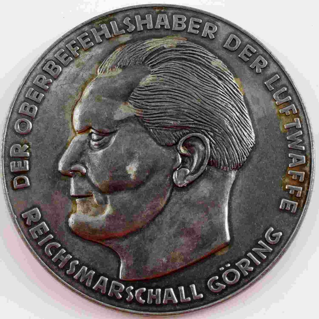 WWII GERMAN LUFTWAFFE GORING MEDALLION AWARD: WWII German Luftwaffe Goring outstanding achievements table award. Bust of Hermann Goring to obverse with outer edge reading "DER OBERBEFEHLSHABER DER LUFTWAFFE REICHSMARSCHALL GORING". Luftwaffe eagl