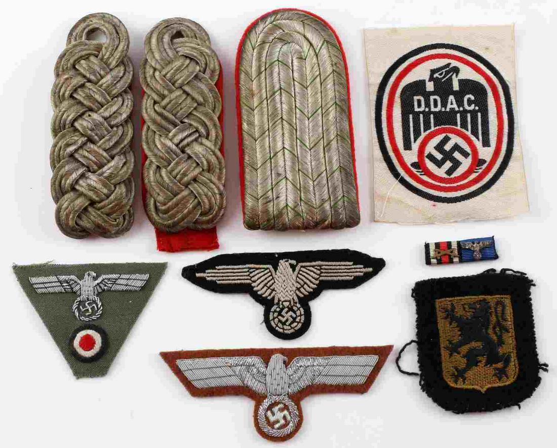 LOT OF 9 WWII GERMAN THIRD REICH SS GENERAL PATCH: Lot of 9 DDAC General SS shoulder boards, ribbons, and patches. Measurements range 1 1/4 - 4 1/2 inches. Good condition. All fluoresce. Unauthenticated, sold as is.