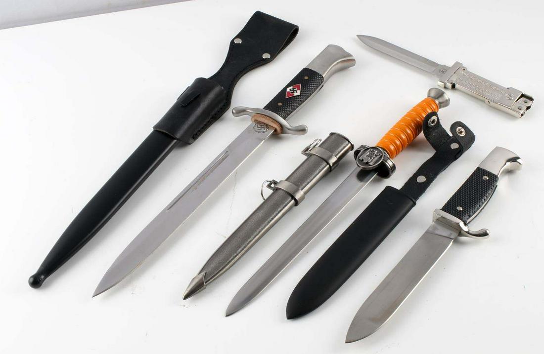 WWII THIRD REICH GERMAN DAGGER KNIFE LOT OF 4: Post-war group of 4 includes: SS Paratrooper folding knife with a 3.75 inch blade, 2 Hitler Jugend daggers, and one Red Cross Social Welfare dagger. Longest measures 16 inches. Very good condition. Un