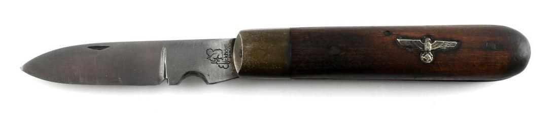 GERMAN WWII THIRD REICH EICKHORN SOLINGEN KNIFE: German WWII Third Reich Eickhorn Solingen Pocket Knife. Measures about 7 3/4 inches long while open. Blade is maker marked Eickhorn with Squirrel emblem. Folding steel blade construction with wooden h