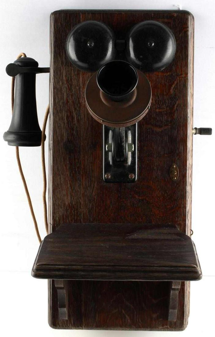 ANTIQUE WESTERN ELECTRIC WALL PHONE 317 SERIES: Western Electric hand crank oak telephone, model 317BL. This model was introduced in 1911, with a 5 bar generator, nickel plated metalwork with black paint. The 317BL had a 38FG Ringer, 1,600 resistan