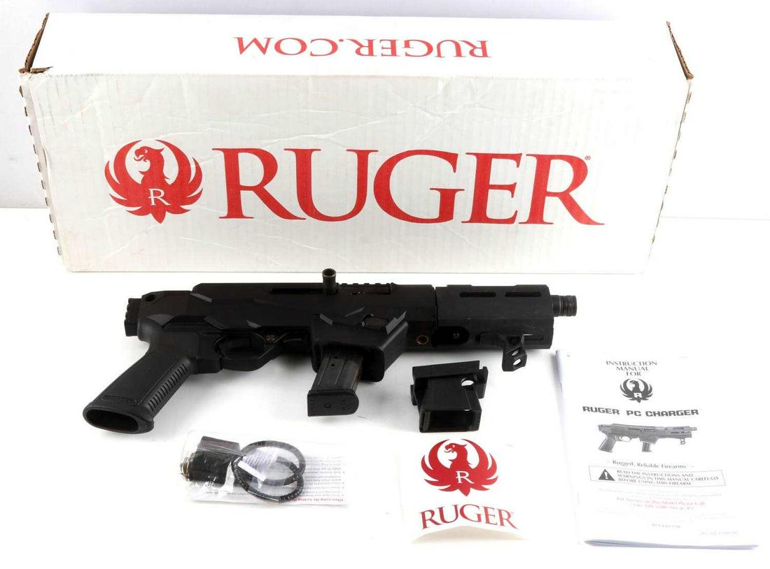 RUGER PC CHARGER SEMI AUTO PISTOL IN 9MM LUGER: All black steel and polymer construction, serial number marked to right side receiver, 6 5/8 inch barrel with bright clean bore, maker and model marked to left side, little wear, heavy scuff on left s