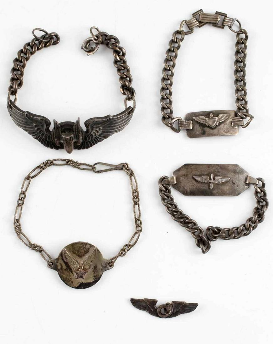 5 WWII STERLING AVIATION ID BRACELET LOT OF 5: Very interesting grouping to include Army Air Corp sweetheart bracelet made from Third Reich 2 mark coin, Sterling Meyer made Aerial Gunner bracelet, named USN pilot ID bracelet, named Army Air Corp s