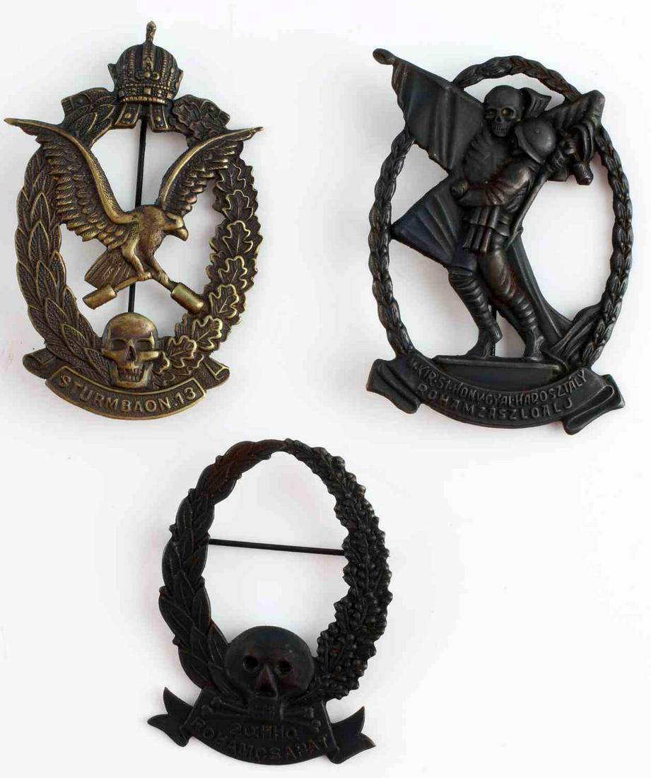 3 AUSTRIA HUNGARY WWI EMPIRE STORM TROOP BADGES: WWI Austria Hungary troop badges. Storm trooper and Shock trooper badges. Stamped construction. Each measure approximately 2 5/8 inches. Good condition. This lot has a reserve.