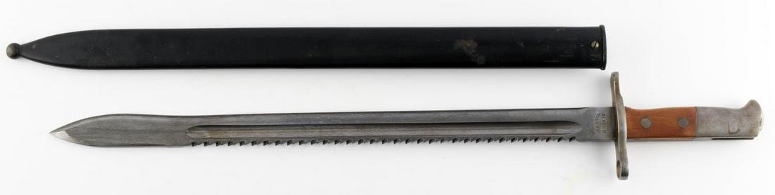 WWI IMPERIAL GERMAN SAWBACK WAFFENFABRIK BAYONET: WWI Imperial German sawback bayonet with blade measuring 18 7/8 inches long, and marked "WaffenFabrik" & "Neuhausen" on ricasso. On crossguard is a cross perhaps indicating that the bayonet is Swiss-m