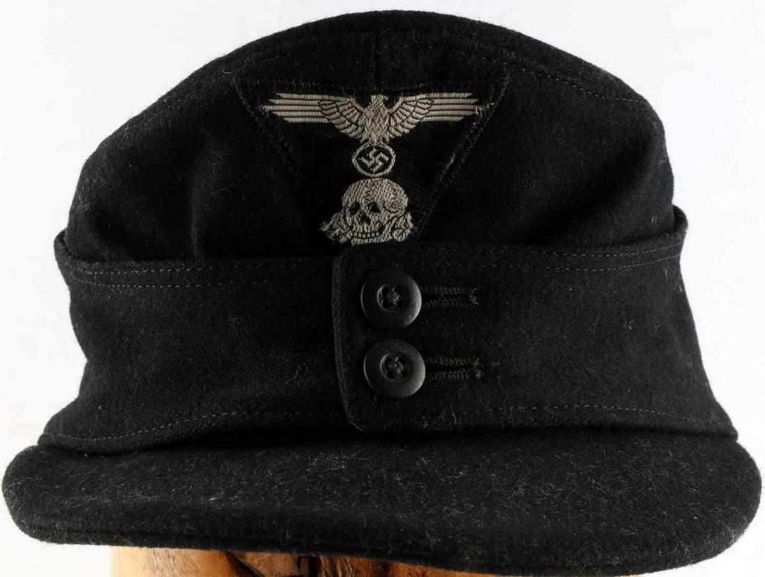 WWII GERMAN THIRD REICH SS PANZER M43 FIELD CAP: Third Reich Panzer M-43 field cap. Features Parteiadler with cockade patch, flat buttons, and silver lining interior. Size 57. Constructed of black wool. Good condition. No mothing. Non-fluorescing.