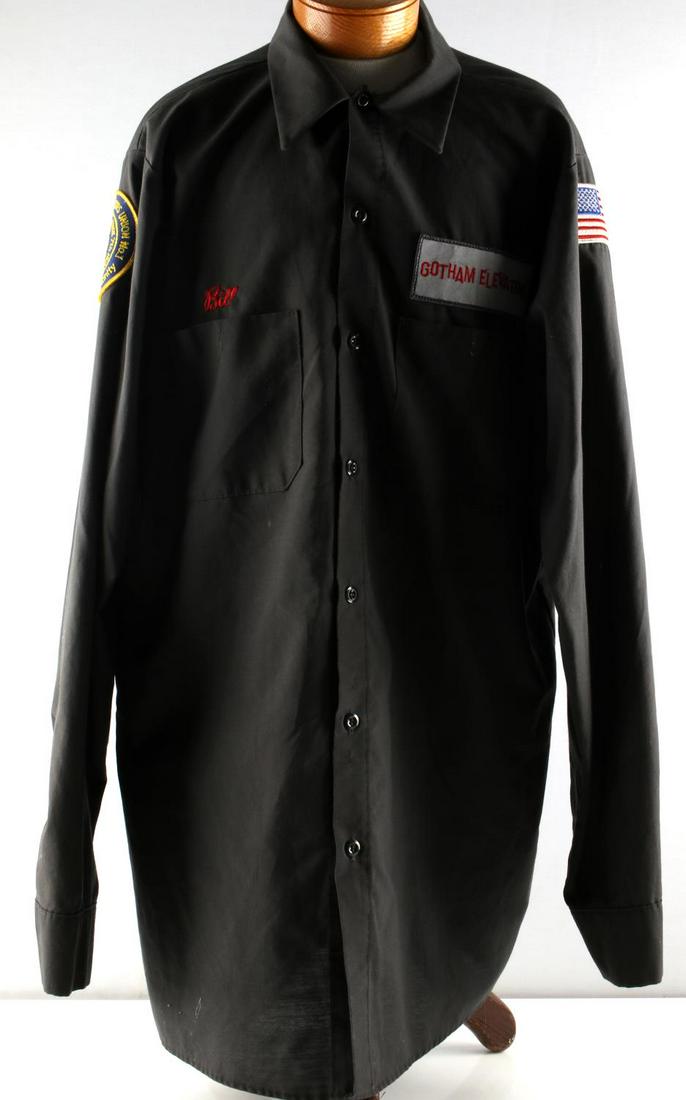 BATMAN FOREVER MOVIE PROP GOTHAM ELEVATOR SHIRT: Batman Forever (1995) movie prop "Gotham Elevator" shirt. Proper patches included. Named to "Bill". Shirt is approximately a size medium to large. Very good condition overall. This lot has a reserve.