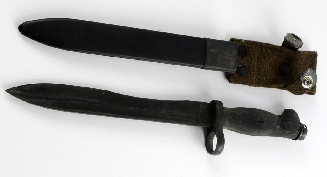 WWII OR LATER SPANISH KNIFE BAYONET W SCABBARD: Just under 9 inch blade, steel fittings, off-set 11 marked to guard, plastic scabbard, and canvas frog. Good condition.