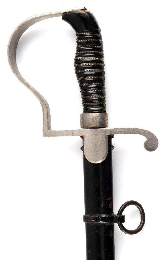 WWI IMPERIAL GERMAN NCO OFFICER SABER SWORD: WWI Imperial German Officer saber. Features nickel plated hand guard, celluloid grip, black painted scabbard and Rob Klaas marked blade. Good condition. Measures 34 1/2 inches.