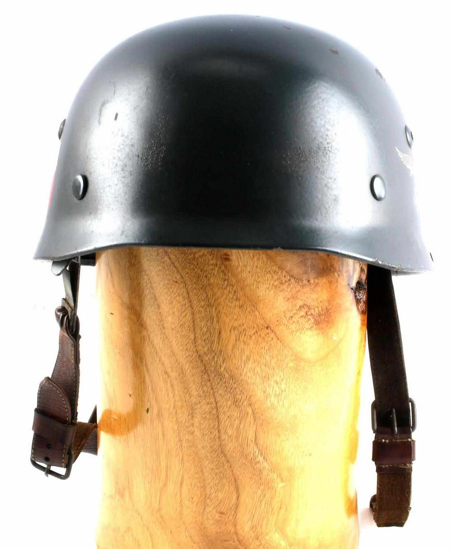 WWII GERMAN LUFTWAFFE PARATROOPER HELMET: Double decal blue steel helmet with 9 finger leather liner, leather straps, ET68 marked to inner left side, and 437 marked to inner rear. Good condition. Unauthenticated, sold as is.