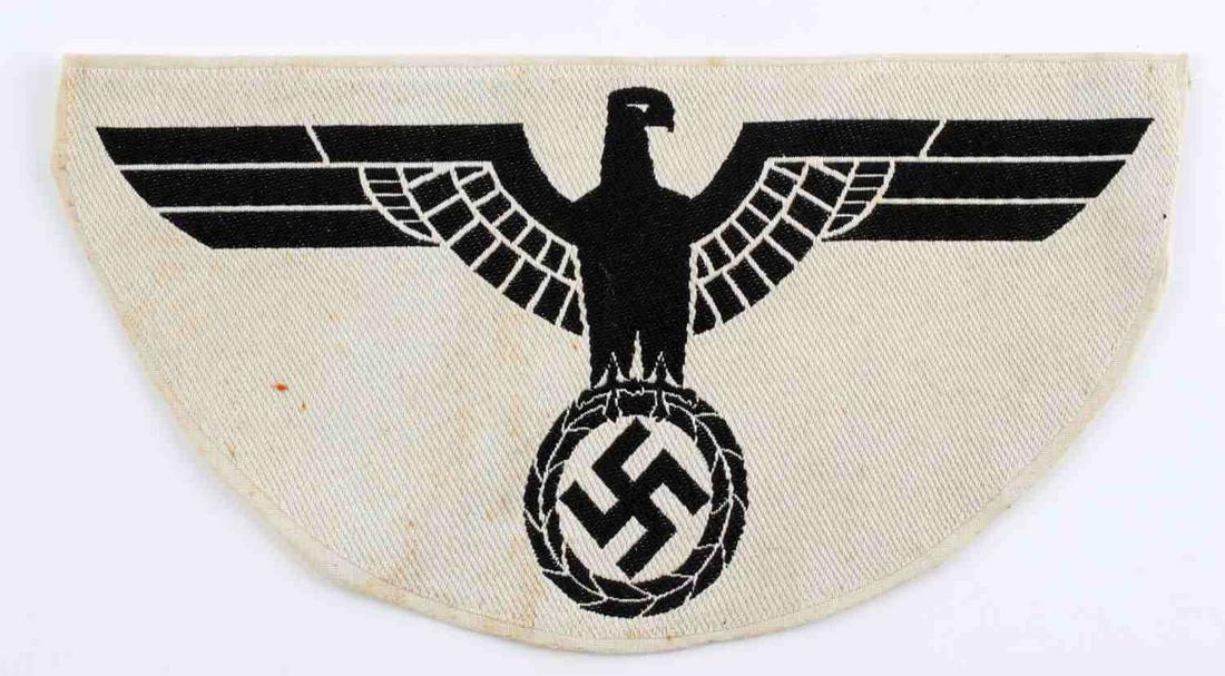 WWII GERMAN REICH KREIGSMARINE SPORTS VEST EAGLE: WWII German Reich Kreigsmarine sports vest eagle measuring 10 inches wide by 5 1/4 inches tall. Parteiadler design is stitched. In good condition, does not fluoresce.