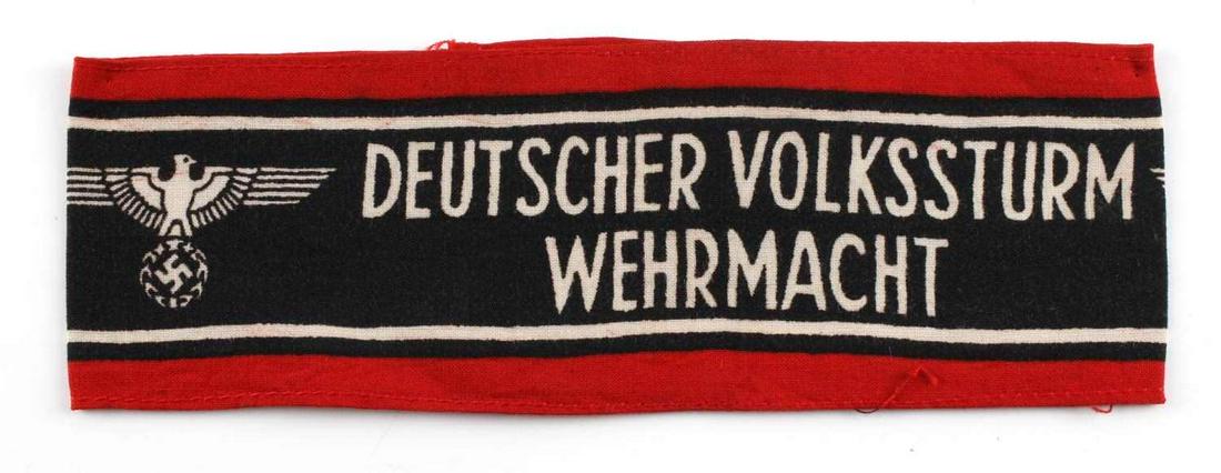 WWII GERMAN REICH VOLKSSTURM WEHRMACHT ARMBAND: WWII German Reich Deutscher Volkssturm Wehrmacht armband measuring 7 1/2 inches wide from the front. Design and lettering is printed on front. In good condition, does not fluoresce.
