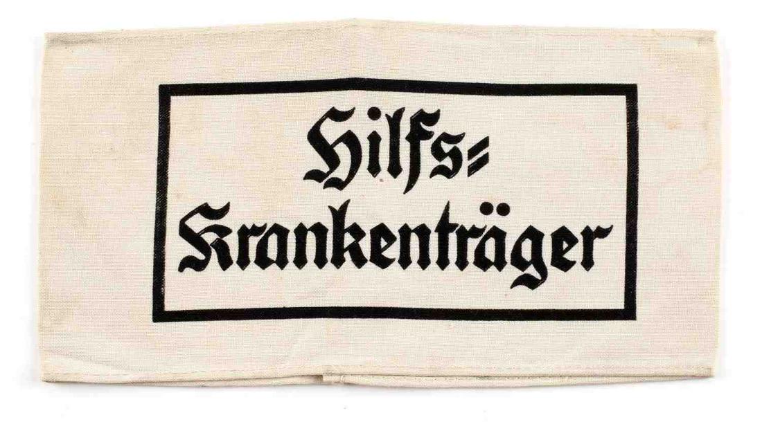 WWII GERMAN REICH HEER STRETCHER BEARER ARMBAND: WWII German Reich Heer medical stretcher bearer armband measuring 7 3/4 inches wide by 4 1/16 inches tall when measured from the front. Design and lettering is printed. In good condition, does not flu