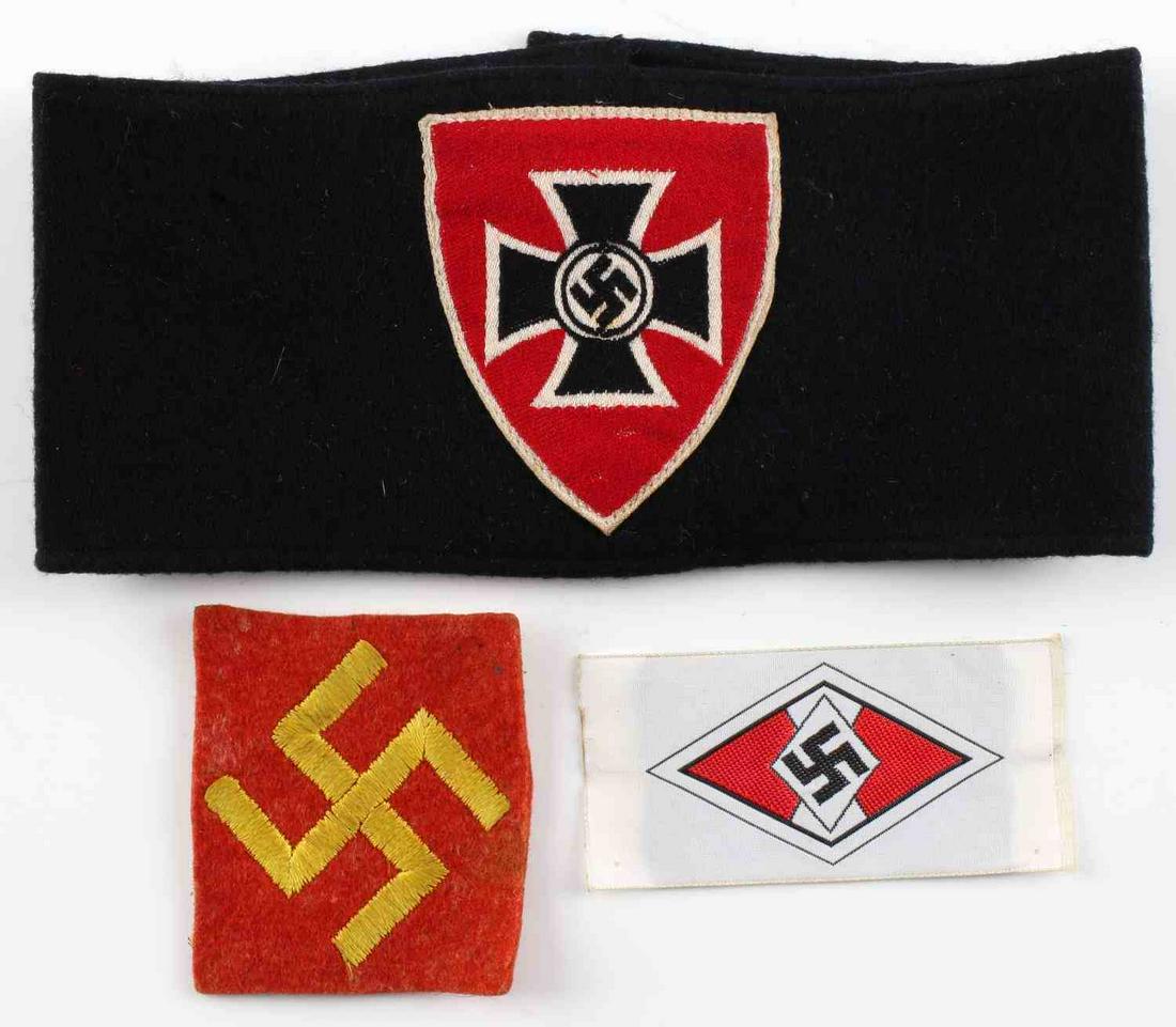 WWII GERMAN REICH SA STORM TROOPER ARMBANDS: WWII German Reich SA storm trooper armband measuring 15 inches when folded all the way out. Also includes a Hitler Jugend small patch, as well as a small yellow swastika on red patch background. The H