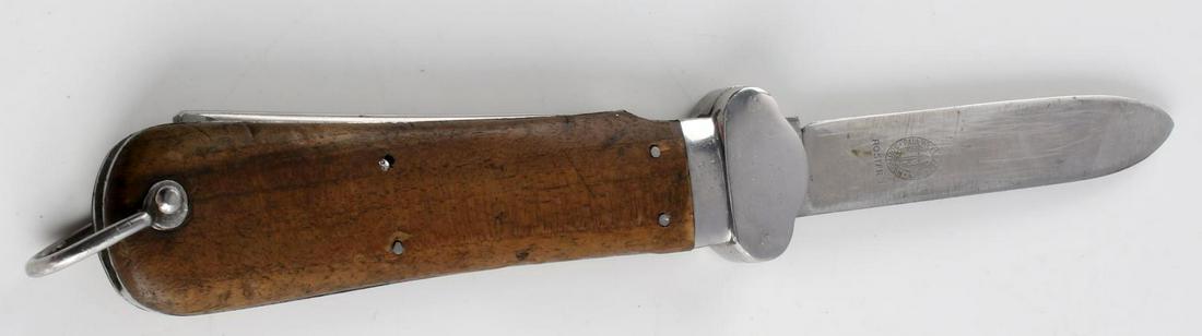 WWII GERMAN PARATROOPER GRAVITY KNIFE SOLINGEN: Paul Weyersberg & Co. Solingen Rostfrei marked to 4 inch blade, wood grip, steel fittings. Fair condition due to missing safety lever, and some wear to blade.