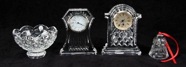 WATERFORD CRYSTAL LOT CLOCKS BOWL AND BELL: Included is a large gold face carriage clock, a Lismore large clock, a 6 inch Cullen bowl, and a Christmas bell carrying a German Waterford label. All are in excellent condition with no chips or crack