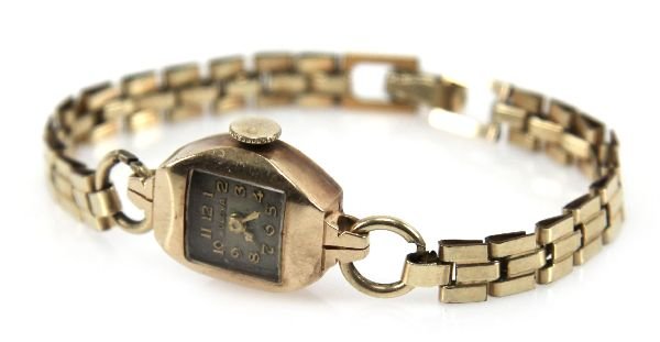 LADIES 14K GOLD BULOVA WRISTWATCH 17 JEWELS: 14K gold case. 17 jewel movement. 14K GF band. In good working condition but as with all time pieces, service is to be expected. . Condition: Good